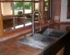 Top mount stainless steel Apron Front sink with High Arc Brushed Nickel Faucet.  